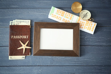Travel concept. Composition with space for text, passport, map and compass on wooden background
