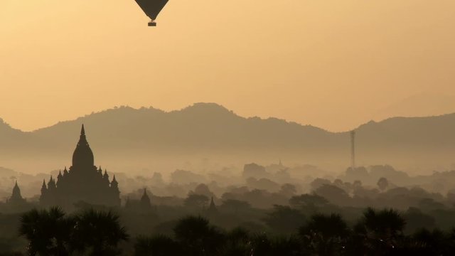 Sunrise at Bagan, air balloons flying over pagodas