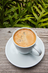 cup of coffee on brown wooden table