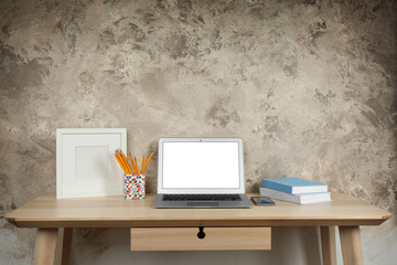 Comfortable workplace with modern laptop