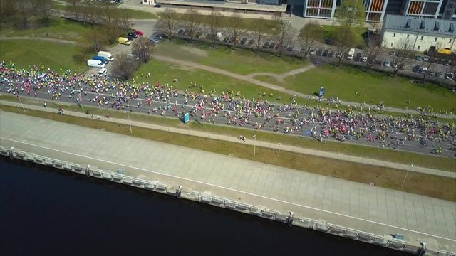 Aerial View of Lattelecom Marathon 2017 in Riga City, Latvia, Top View of People running along the Daugava River, Krastmala Street, View from Above