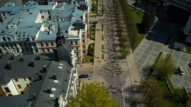 Aerial View of Marathon Runners run at the Riga International Marathon, Riga, Latvia, Sunny Spring Day, Riga Streets from Above
