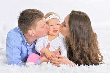 Happy parents with little daughter
