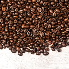 Coffee beans background macro. Dark Roasted coffee beans textured wallpaper for your design with copy space.