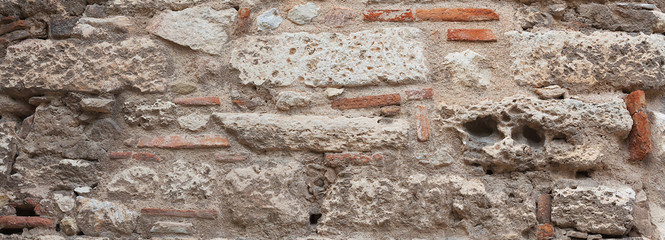 Ancient stone wall close-up.
