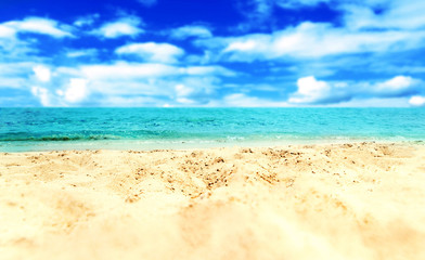 Fototapeta na wymiar Sand Beach and blue sea - Tropical Holiday Background.