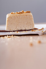 Parfait with nuts on broken plate