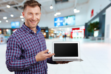 Handsome man using laptop