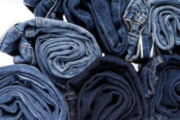 torn jeans stack background blue denim fashion beauty