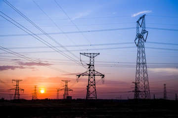 Fototapeta premium The silhouette of high voltage towers
