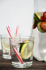 Water with lemon strawberries and cucumber
