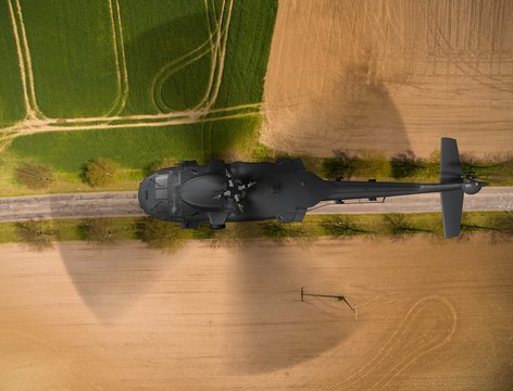 
Black Hawk military Helicopter in flight - aerial view close up