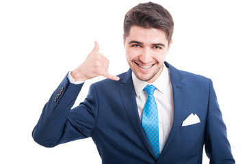 Happy handsome salesman showing hand phone