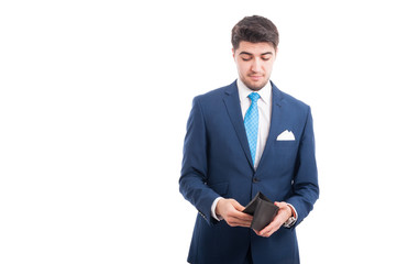 Young broker looking inside his wallet