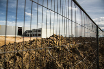 Fototapeta premium Construction site with a fence around it