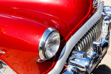 Hood of an old retro or classic car in a car shop