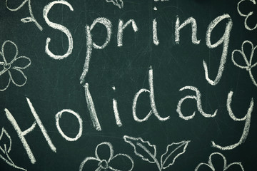 Text SPRING HOLIDAY written on chalkboard