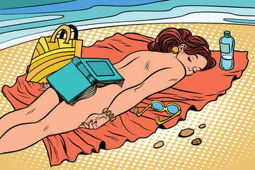 Naked woman sunbathing on the beach