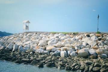 Seascape view of lifeguard tower and wooden bridge in at Khao Leam Ya - Mu Ko Samet, Rayong Thailand