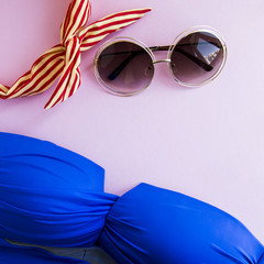 Sunglasses for summer on a bright pink background
