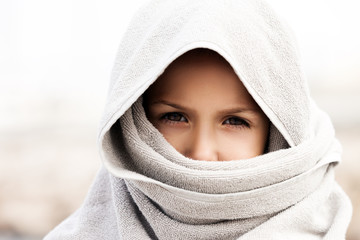 Fototapeta premium Little child boy wearing arabian burka style clothing