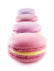Colorful French almond cookies macarons or macaroons isolated on white background
