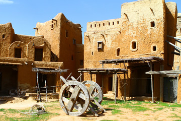 Old clay mongol city - buildings and wheeled cart