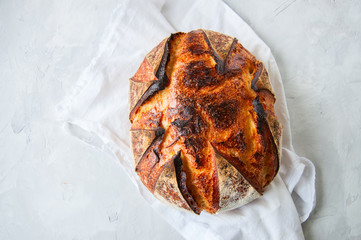 Close up of freshly baked sourdough bread. Top view and copy space.