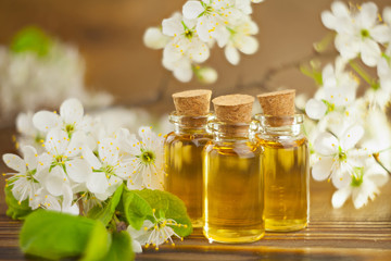 Essence of flowers on table in beautiful glass jar