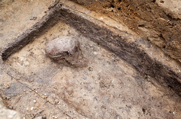 Archaeological excavation with skeletons