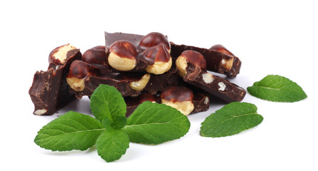 chocolate candies sweets with hazelnut and mint isolated on white background