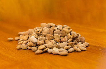 Kernel of apricot dry grains on a wooden background close-up