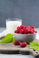 Fresh cow milk and ripe organic red raspberry