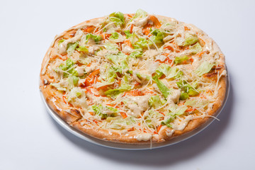 Italian delicious pizza with tomato, lettuce and cheese.