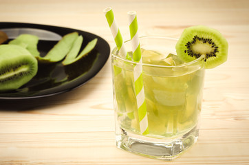 glass of cocktail with kiwi preparation/preparation of cocktail with a kiwi