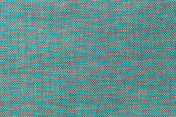 Fototapeta na wymiar Blue textile background with chess pattern, closeup. Structure of the fabric macro.