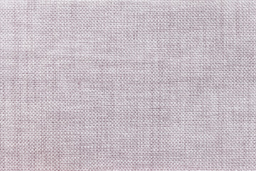 Light gray background of dense woven bagging fabric, closeup. Structure of the textile macro.