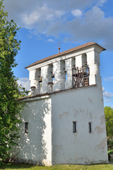 Fototapeta na wymiar The bell tower of the assumption Church in Olginskaya waterfront of the river Great