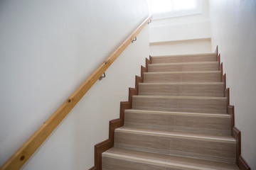 Fototapeta na wymiar Concrete Staircase with wood handrail