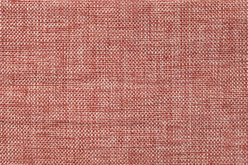 Light brown background of dense woven bagging fabric, closeup. Structure of the textile macro.