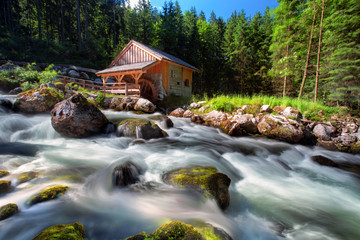 Old mill and beautiful Golling waterfall and near Golling and Salzach medieval town in Austria © Bill45