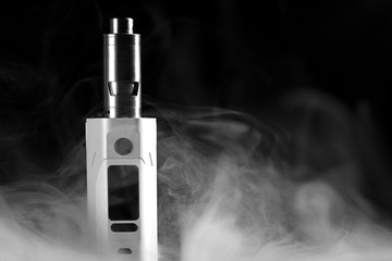 Electronic cigarette over a dark background.