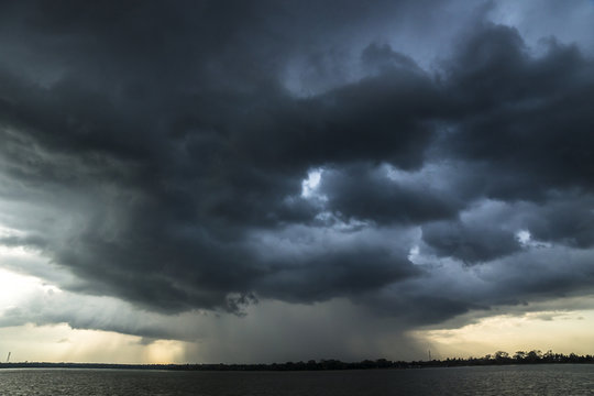 Storm and raincloud over lake in Sri Lanka