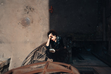 Girl posing on a spiral staircase