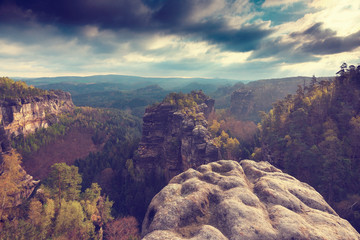 Misty valley, sharp rocks gentle cut creamy fog to strips. Long deep valley full of fresh spring mis © rdonar