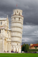 Square of Miracles and the Leaning Tower of Pisa in a stormy sky