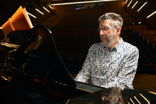 Senior man playing piano