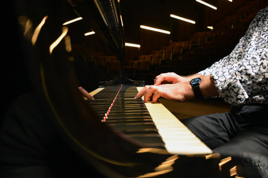 Crop shot of male playing piano