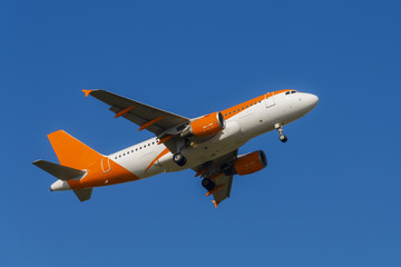 Airliner taking off from Newquay Airport, Cornwall, UK against a perfect blue Cornish sky. All branding removed for perfect generic (budget) airline image.
