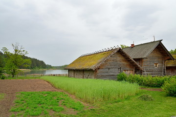 The garden and the old Russian log hut in Pushkin Mikhailovskoe